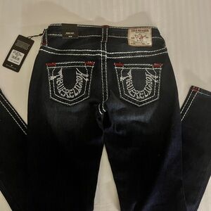 Dark blue true religion mid rise skinny jeans ;) 
Size 26